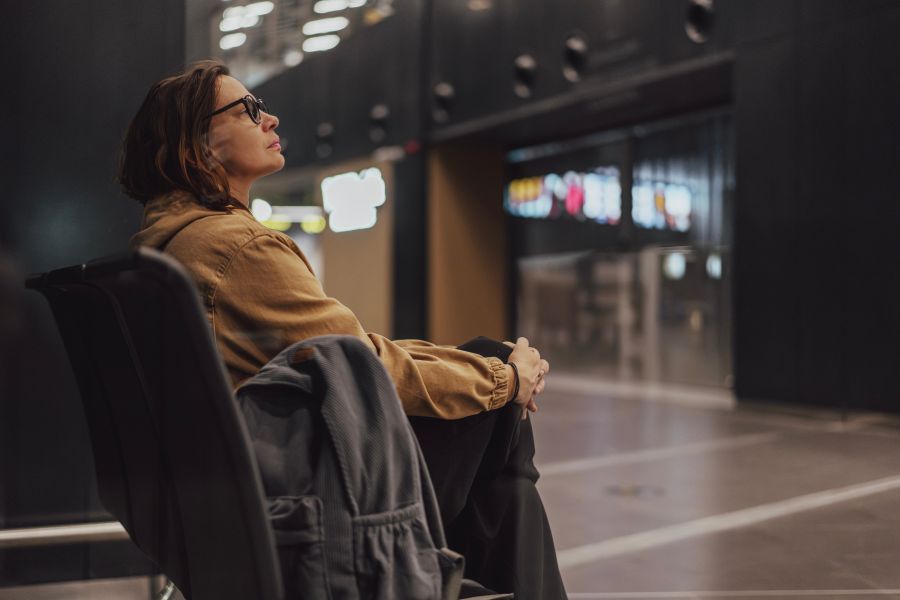 Woman,Waiting,For,A,Flight